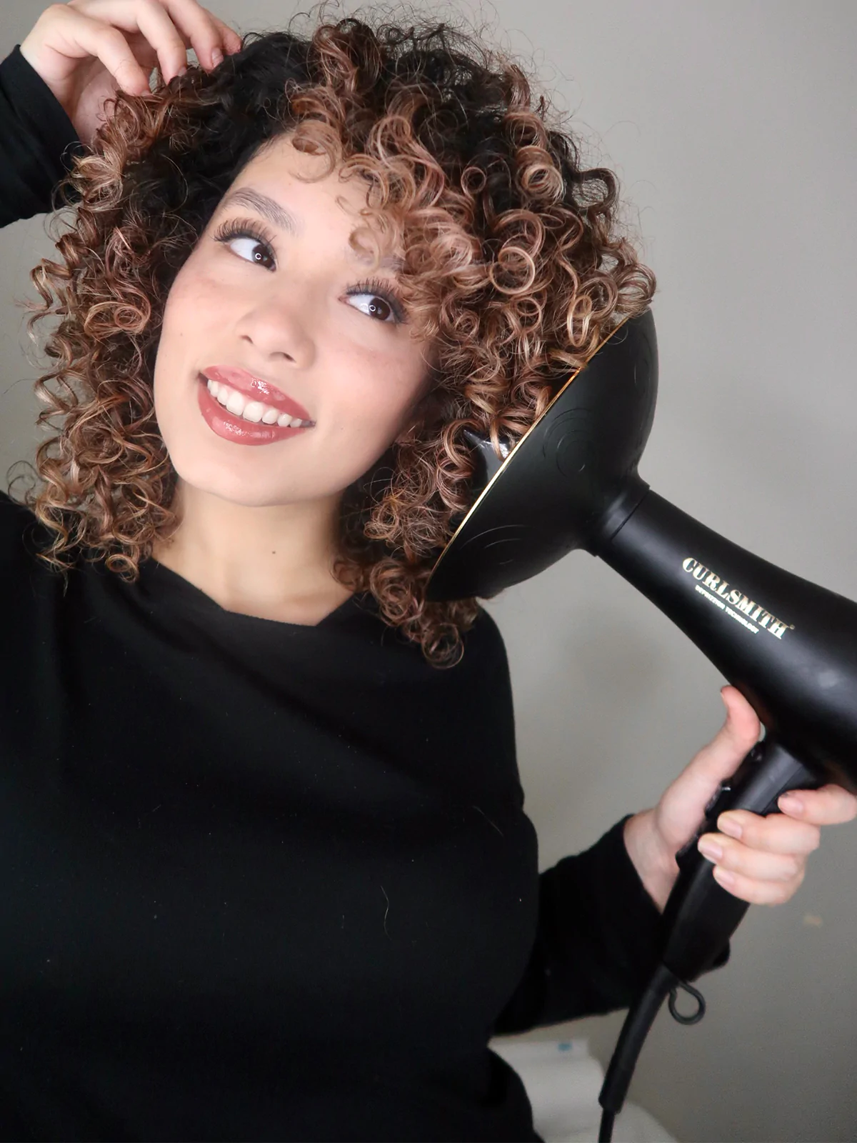 TikTok's Latest Haircare Hack Involves Using a Pasta Strainer to Diffuse Hair