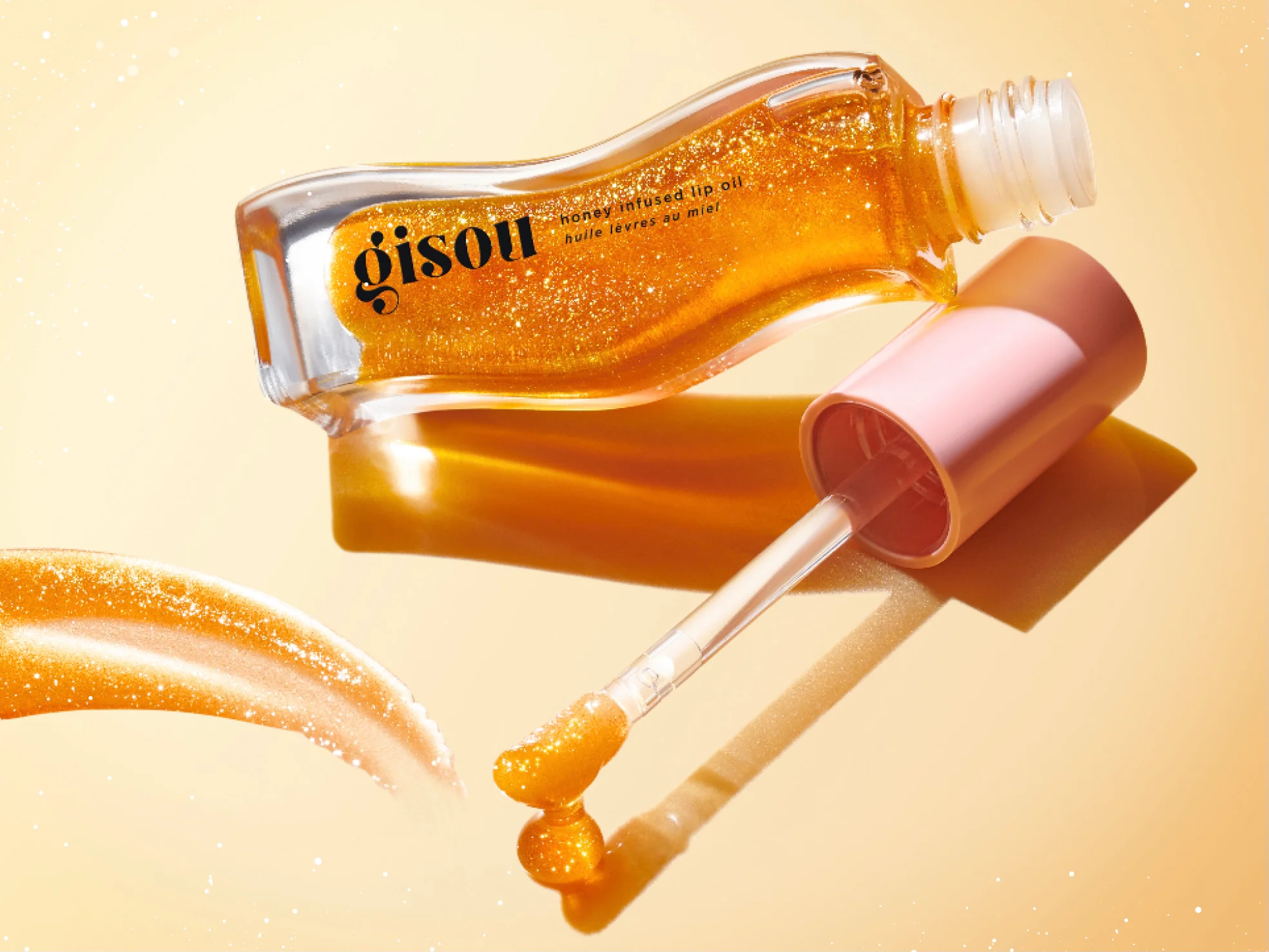 That Extra Glow with Gisou’s Honey-Infused Lip Oil Golden Shimmer 